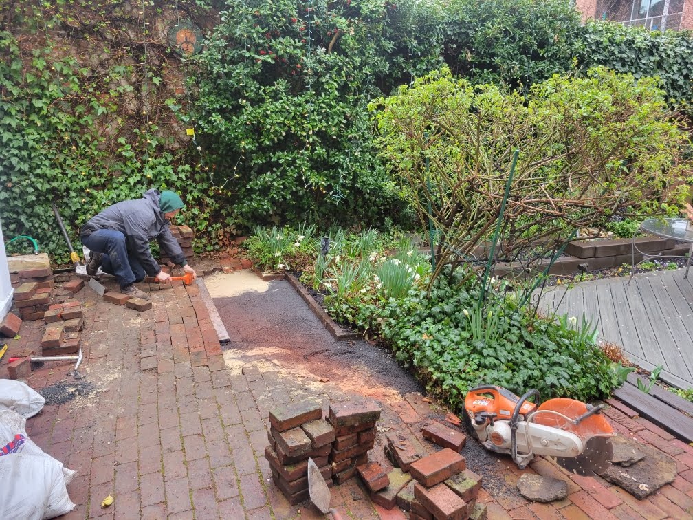 Liberty crew working on hardscaping project to build patio.